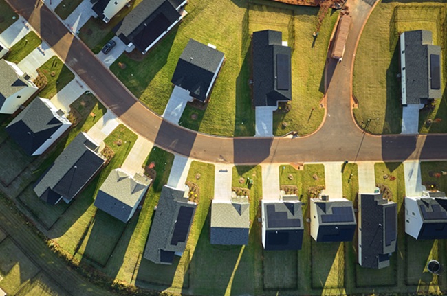 Aerial view of tightly located new family houses in South Carolina suburban area. Real estate development in american suburbs.